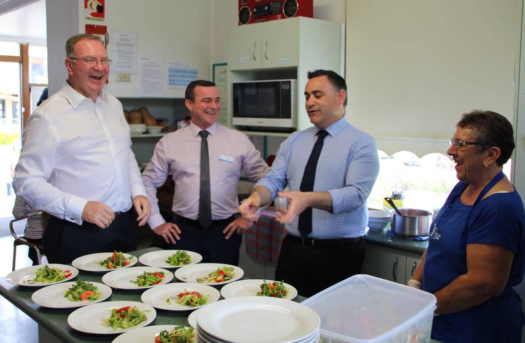 Happy: Member for Myall Lakes Stephen Bromhead, Director of CatholicCare Services Hunter-Manning Gary Christensen, NSW Deputy Premier John Barilaro and volunteer Beverly Weiley discuss food and fundraising for Taree Community Kitchen.