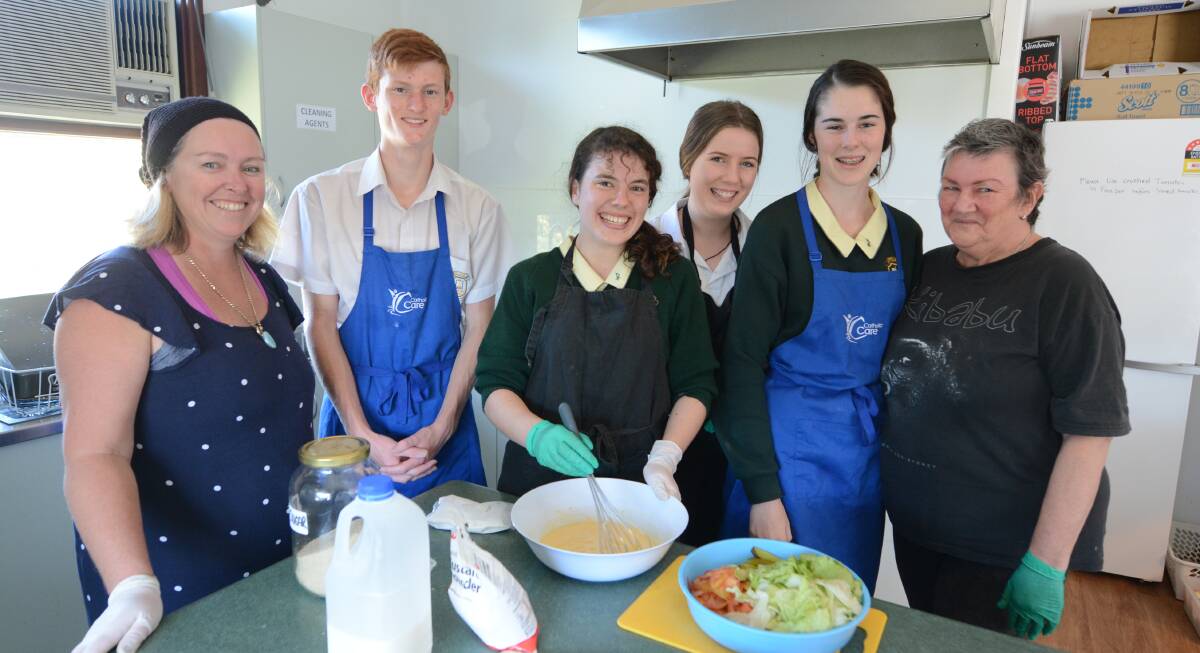 St Clare's High School staff and students work to prepare food. Pictured is Karen Grant, Griffin Hearn, Alexis Cameron, Olivia Crutcher, Zoe Lees and Lyn Tilbrook.