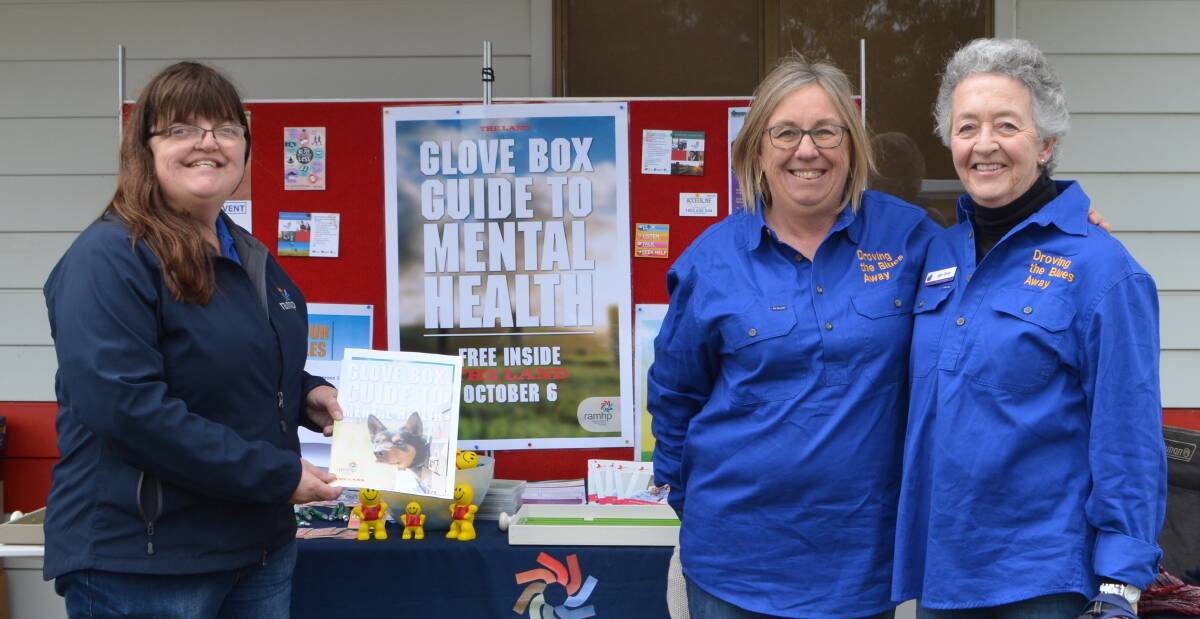 RAMHP co-ordinators Helen Sheather and Merilyn Limbrick, with Jan Grey from Riverina Bluebell, promote the Glove Box Guide at Henty Field Days.
