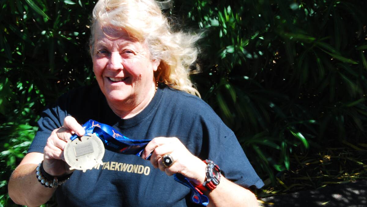 Taekwondo seventh dan master Fay Shacklock has returned from the Pan Pacific Games at the Gold Coast crowned with gold for twenty five years of power breaking wins.