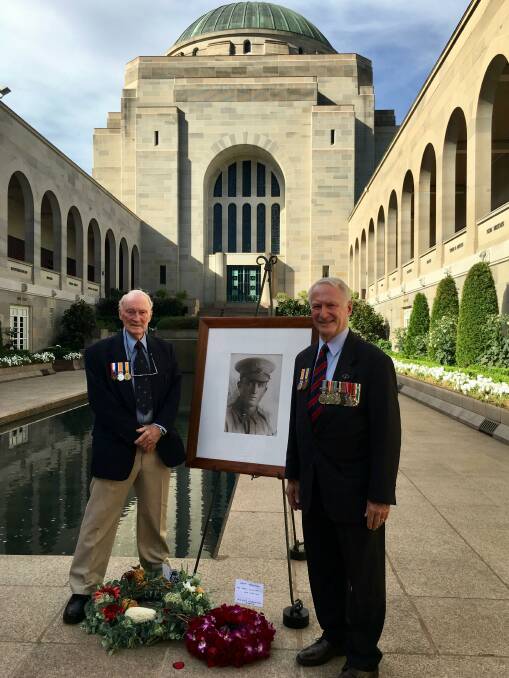 At the Australian War Memorial in Canberra: Phil Wilkins and David Wilkins before the photograph of their uncle, Philip Wilkins, shot and killed on the Western Front a century before in World War I.