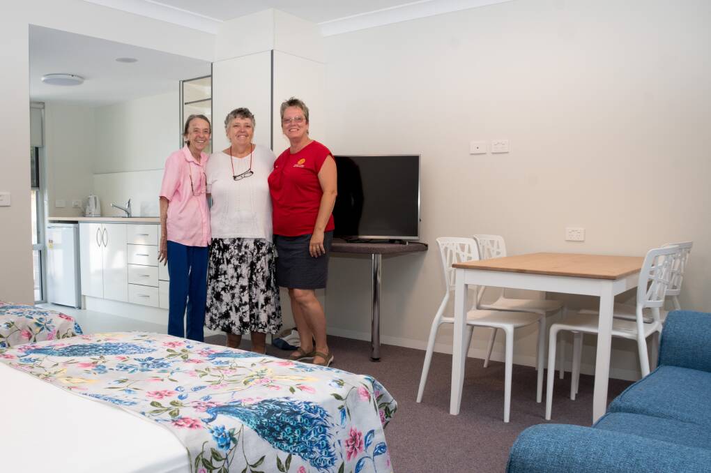 Ready to go: Rotary Lodge Port Macquarie manager Paula Johnson (right) shows one of the new rooms to Colleen Muras from Wingham and her carer Sharon Dodd from Taree.

