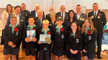 Old Bar Public School students and invited guests at the school's Anzac commemorations. Picture Therese Early. 