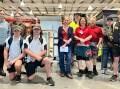 Students from Taree and Chatham high schools with CatholicCare volunteer coordinator Meg Norling, Bunnings activities organiser Georgina Aldridge and Bunnings team member Tai Weiley, in front of the cabinets being handed over. Picture supplied.