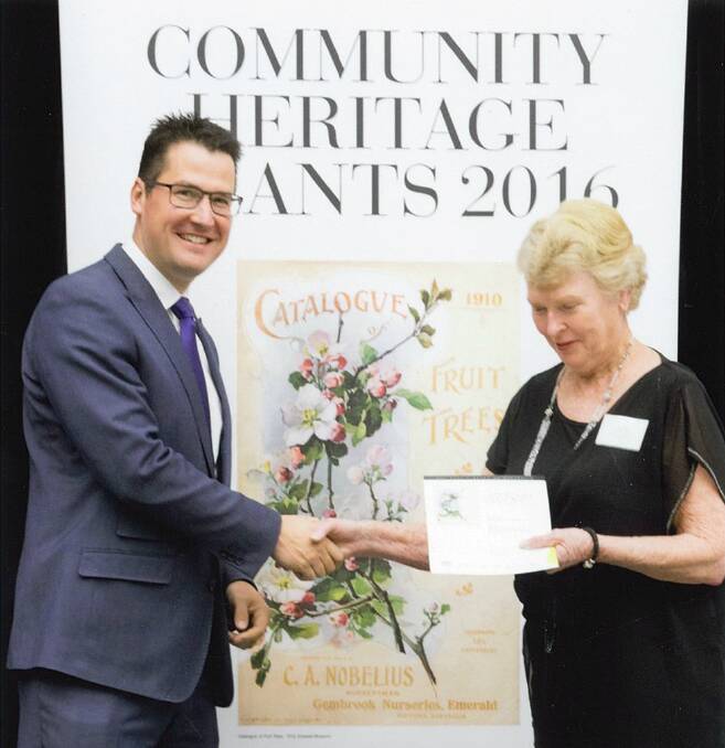An honour: Senator Zed Seselja presenting the Community Heritage Grant at a  ceremony at the National Library in Canberra to Manning Valley Historical Society president Barbara Waters. Photo: supplied.
