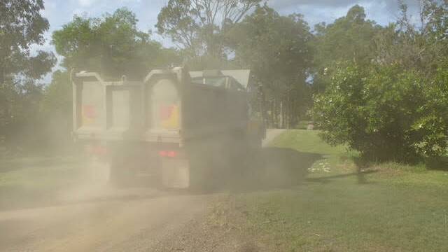 Neighbours have complained to the operator about the dust thrown up by the trucks going past their houses, to no avail. Photo: supplied
