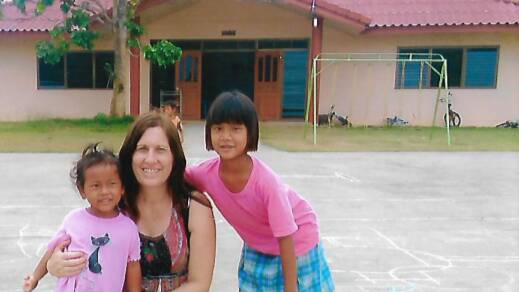 Please help: Nicole Rowsell with children from the Mercy International school and orphanage. Photo: supplied