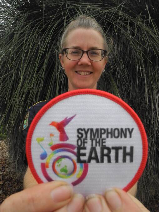 Collectors item: Kerrie 'Kaa' Guppy with one of the first 100 Symphony of the Earth camp blanket badges. Photo: Julia Driscoll
