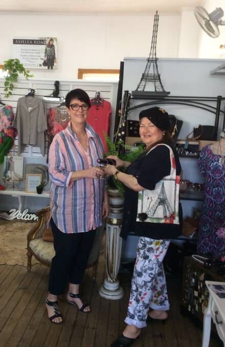 Ashlea Road Boutique's Marcia Bourke sharing a bottle of bubbly with Madame Pettifleur in preparation for the Parisian-themed fashion show.