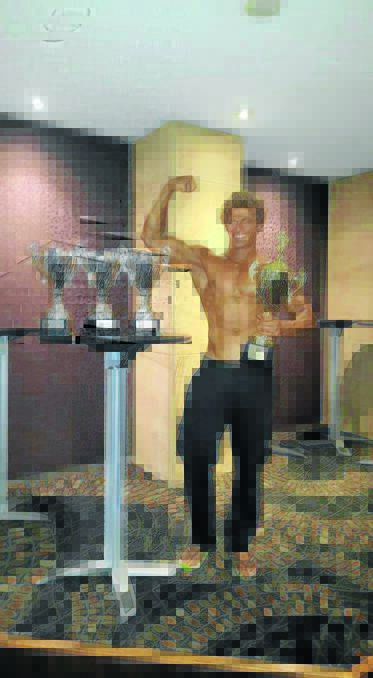 Muscle man: Mitch Orr with the trophies he won in the regional bodybuilding titles in Newcastle.