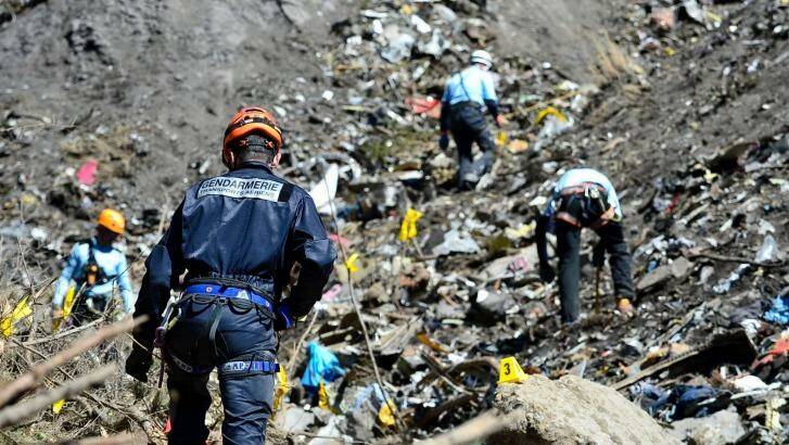 French emergency rescue services work at the site of the crash in March. Photo: AP/Francis Pellier