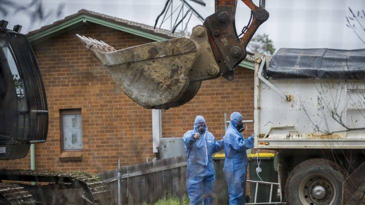 Buy-back: Asbestos is removed from a home in Canberra. Photo: Rohan Thomson