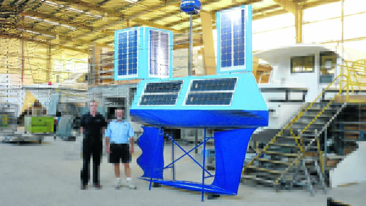 Robert Dane and Alan Steber at Steber's Taree factory with one of the Bluebottle range of 
USVs.