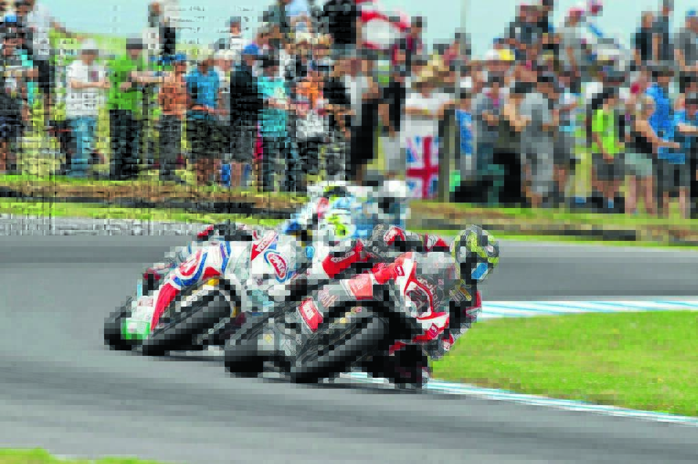 Troy Bayliss dices with world champion Sylvain Guintoli.