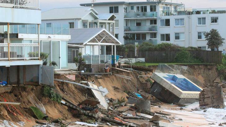 The Collaroy homes, including Mr Silk's at left, and the smashed pool, in the immediate wake of the storm. Photo: Peter Rae