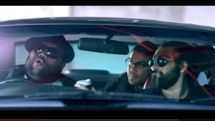 Briggs rapping, left, with Dan Sultan, back, and Trials, front right, in new music video January 26. Photo: A.B. Original/Bad Apples Music