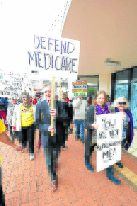 Labor candidate for Myall Lakes, David Keegan carried the 'Defend Medicare' sign in Taree's March in August on Saturday, August 30.