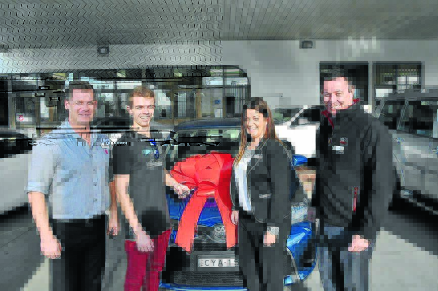 Adam Bailey, competition winner Luke Wrigley, Nicole Micos and Justin Wilkie with the prize car.