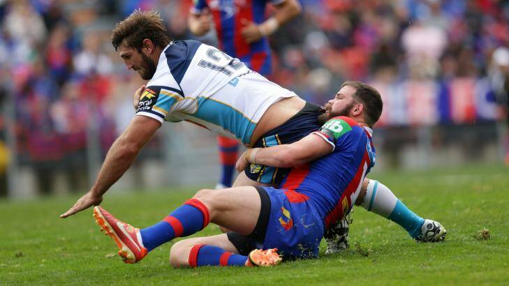 Spoiler: Titans player Dave Taylor scores a try against the Knights. Photo: Jonathan Carroll