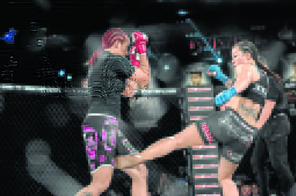 Take that: Arlene Blencowe lays into Adrienna Jenkins during their Mixed Martial Arts bout in America, Blencowe scored the biggest win over her MMA career. 