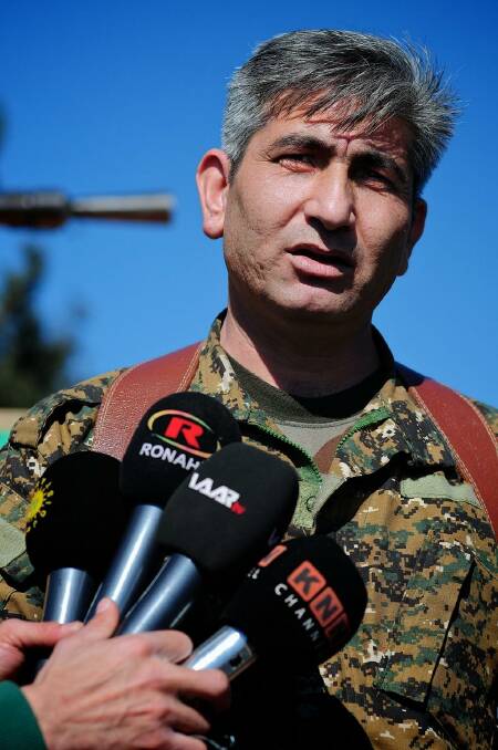 Redur Khalil, a spokesman for the Kurdish YPG militia, near the besieged town of Tel Hamis.  Photo: Fadi Yeni Turk