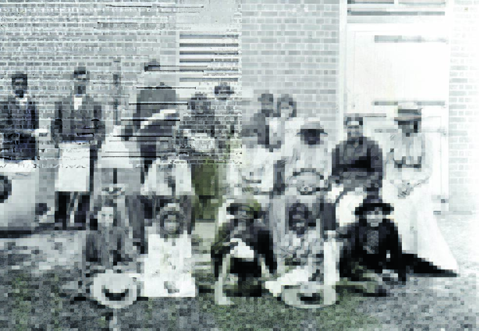 Rations given out to Aboriginal residents living at Browns Hill during the mid-1850s. From the left back row: Jack Lobban, Alex Smith, Ned Marlow, Constable Thomas Wells, Lizzie Smith with her son, Arbie, Ted Lobban, Georgina Russell. Second row: Billy Bungay, Anne Russell, Helen Lobban, (unknown first name) Fields, Rachel Bugg. Front row: Ivy McKinnon, Sylvia McKinnon, Charlie Smith, Fanny Smith and Ernest McKinnon.