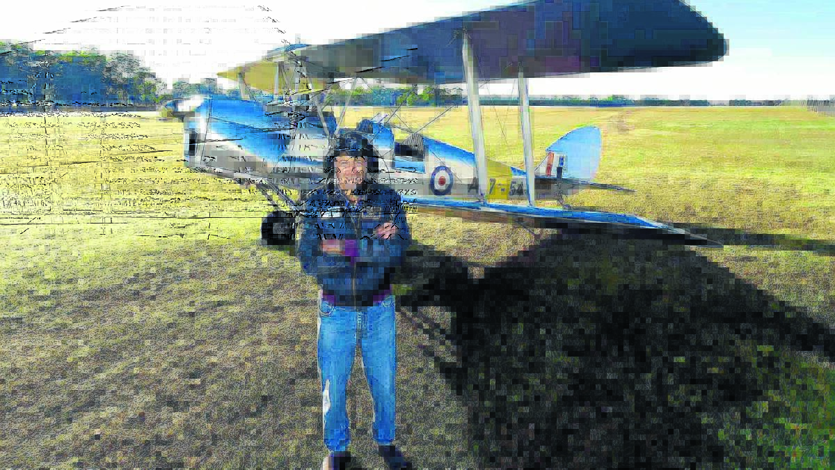 Brian Bignell recipient of the Royal Federation of Aero Clubs of Australia Federation Award, it's highest honour, on the grass strip at Taree Airport with his beloved DH 82 Tiger Moth which he has meticulously restored. Ashley Cleaver photo