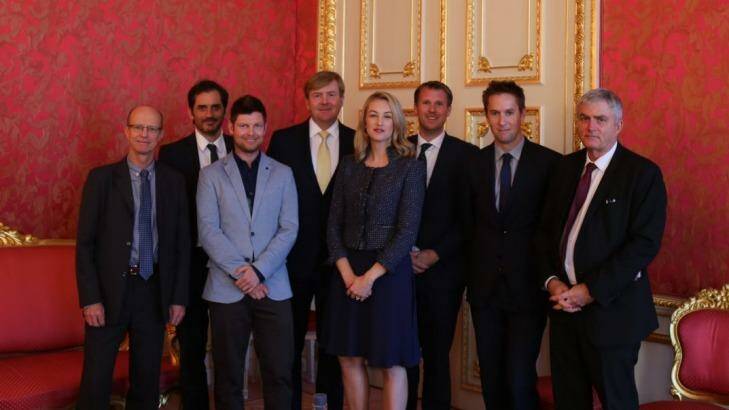 King Willem-Alexander, centre back in gold tie, with Australian journalists including Nick Miller, second left, at the Noordeinde Palace's Cherub Room. Photo: Nick Miller
