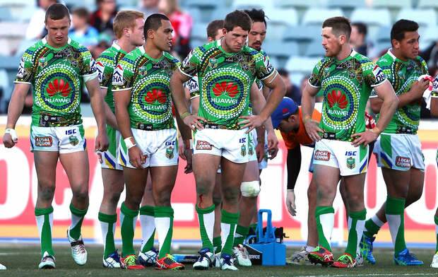 CANBERRA, AUSTRALIA - AUGUST 16:  Dejected Raiders players wait for a conversion during the round 23 NRL match between the Canberra Raiders and the St George Illawarra Dragons at GIO Stadium on August 16, 2014 in Canberra, Australia.  (Photo by Renee McKay/Getty Images) Photo: Renee McKay