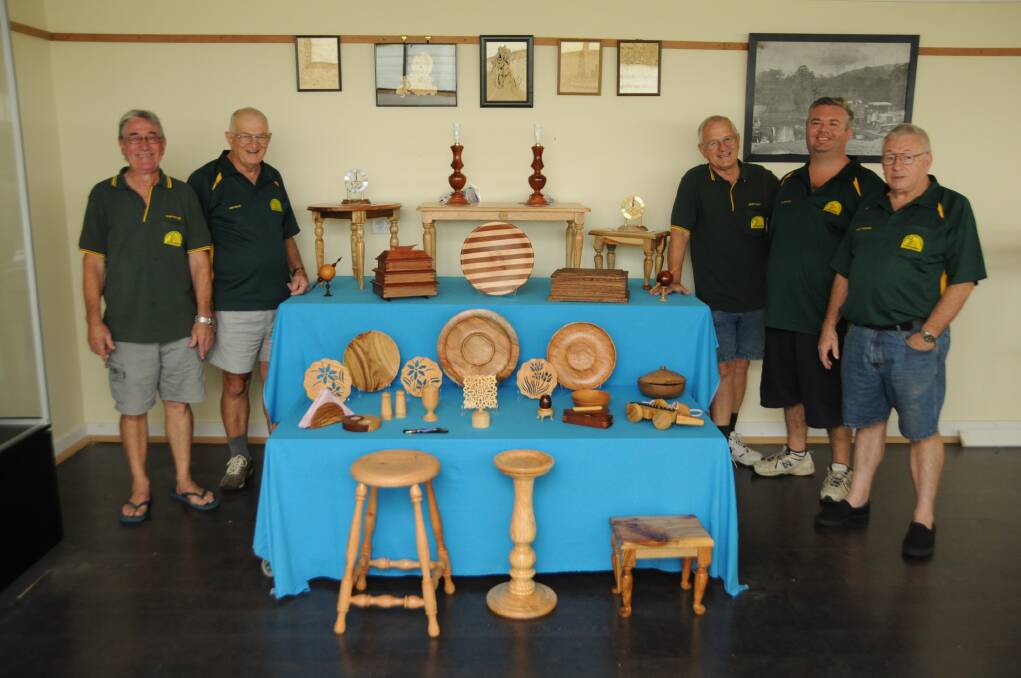 Manning Great Lakes Woodworkers Allan Poulton, Ivan Holley, Geoff Crapp, Mike Reynolds and Bernie Parmenter with a selection of work that will be on show during their Woodfest and Craft Exhibition on April 19.
