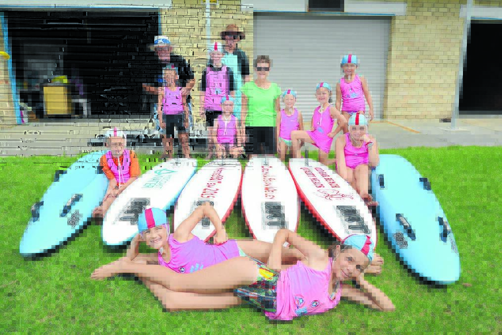 Taree Old Bar Surf Club members Lucy Kelleher, Lily Richardson, Rory Jedges, Cody Weatherly, Shannayah Bishop, Hope Taaffe, Stella OConnor, Abbey Harrison, Zac Madely, Stuart Platt, Ron Sawyer, Carol Weiley and Connor Heming with the club s new boards.