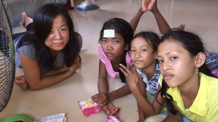 American volunteer Ame (left) with three of 65 children at the Poor Street Children and Orphans Training Centre in a suburb of Phnom Penh. Most of the children there are not orphans.
Picture: LINDSAY MURDOCH Photo: Lindsay Murdoch