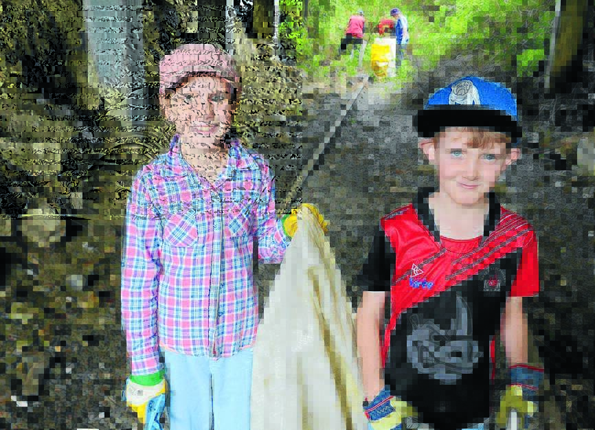Chloe and Jack Whyte gloved up to collect bags of rubbish from the railway cutting under Crescent Avenue.
