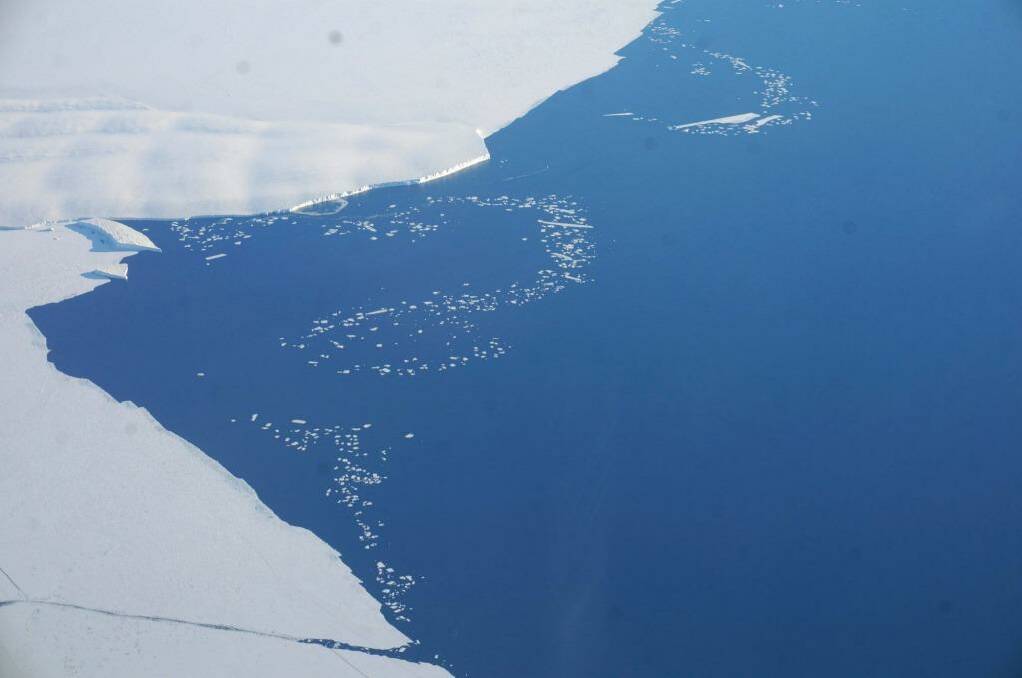 Midnight flight: Ice bergs break off the Ross Ice Shelf, Antarctica on New Year's Eve. Photo: Steve Meacham