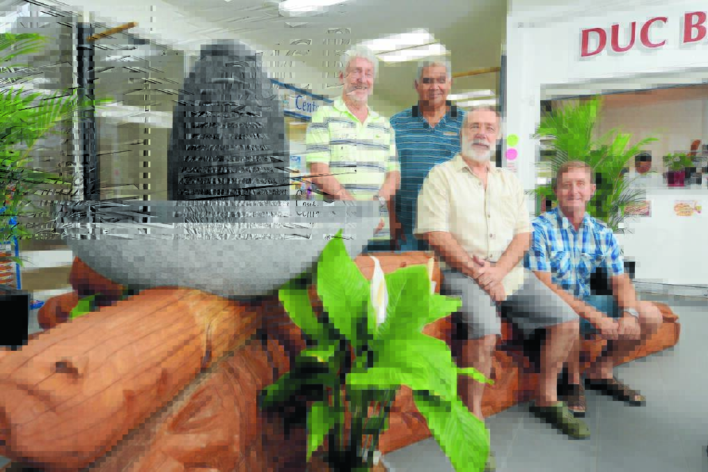 Representatives of the owners of the arcade Maurie Stack, artist Russell Saunders, architect Charles Rose and builder Mark Woodward with the new sculpture. 