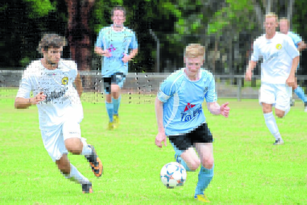 Taree's Brendan Aquilina races into space during the FFA?Cup clash against Tuncurry-Forster at Omaru Park in February. The sides meet again tomorrow in the Football Mid North Coast Premier League encounter, again at Omaru.