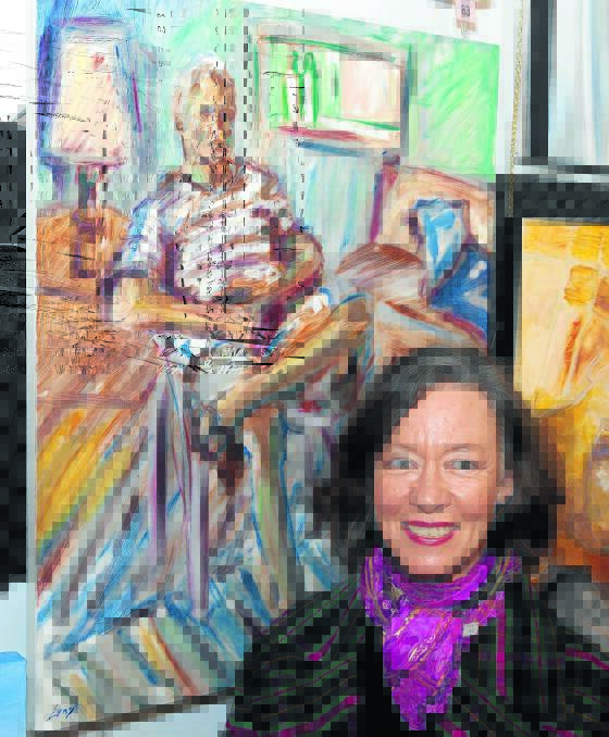 Artist Jo Ernst with her work, Study of Pete, which earned her a commended in the works on board or canvas section.