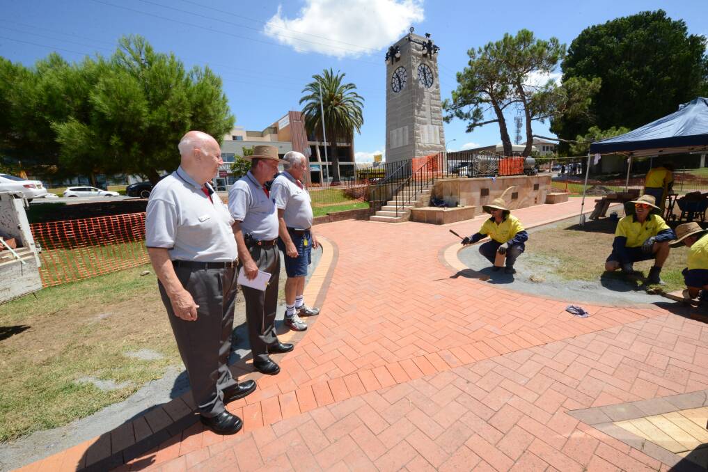 Honorary secretary of the RSL sub-branch Dennis Lawrence, senior vice president Darcy Elbourne and president Bob Coombes overseeing work done around the memorial.