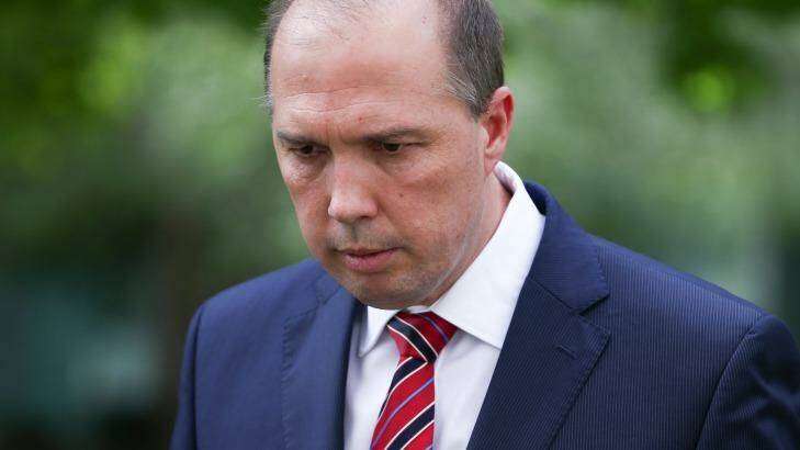 Immigration Minister Peter Dutton departs after addressing the media during a doorstop interview on the Christmas Island situation, at Parliament House in Canberra on Tuesday. Photo: Alex Ellinghausen