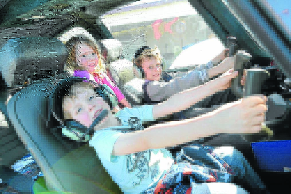 Flying high: Joshua, Lachlan and Amelia Patterson jump behind the controls.