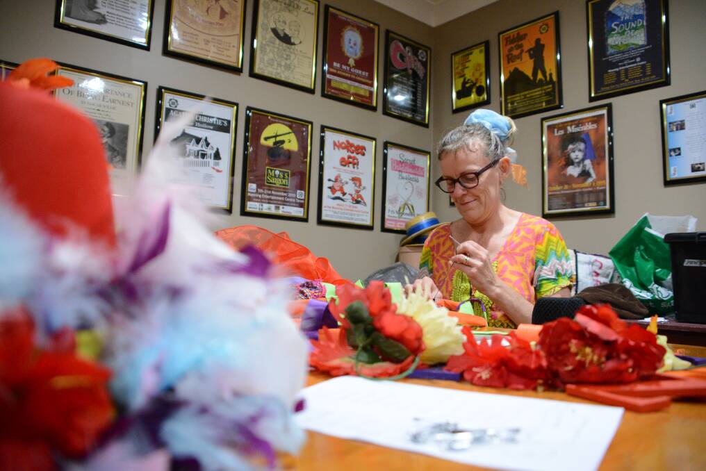 Sammy Clarke amongst the feathers and fabric as she creates costumes for the Supercalifragilisticexpialidocious scene.