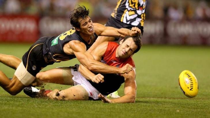 Alex Rance (left), seen here preventing Melbourne's Cameron Pedersen from getting the ball, will miss the game against Carlton. Photo: Pat Scala
