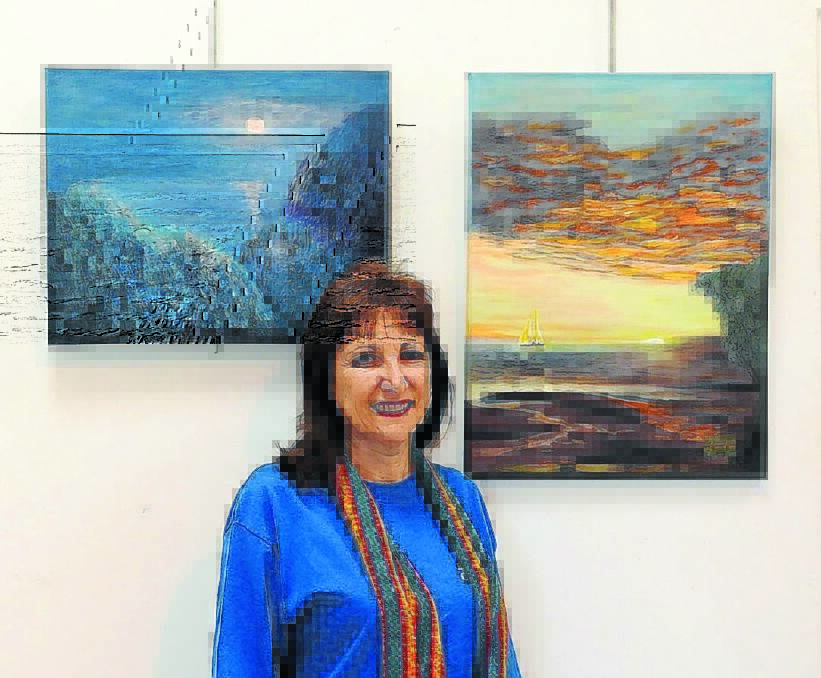 Pictured: Dawn Myree with two of her works.