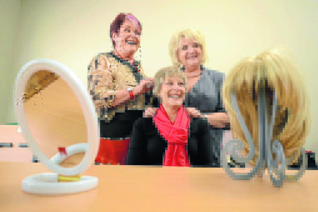 Petra Karl (right) demonstrates to Judith Tovey the process of fitting a wig on Robyn Streatfield. After a decade of supporting the wig service with her skills, Petra is keen to step back from the role and hand-over to some young hairdressers. She is hoping a few hairdressers will commit to giving their time.