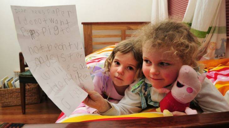 Peppa Pig fan, Tess Coventry, 5 with the letter that she wrote to the paper hoping that Peppa Pig wouldn't be taken from her tv because her sister India, 2 1/2 would be sad.  Photo: Melissa Adams