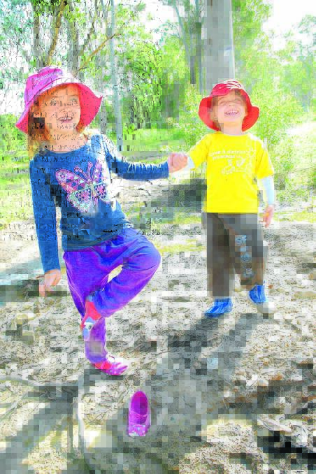 Mia Snelgar lost her shoe in the mud, she was not worried. Mia and her classmate Byron Boyling simply laughed and continued their fun during 'Bush Learning'.