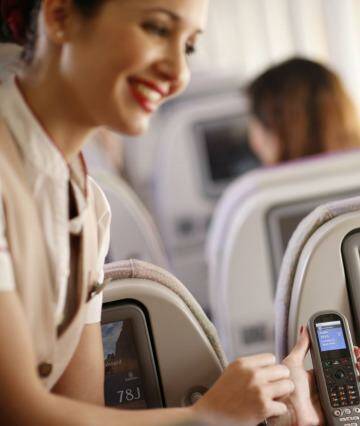 Emirates staff are happy to help passengers navigate the extensive onscreen entertainment selection. Photo: Supplied