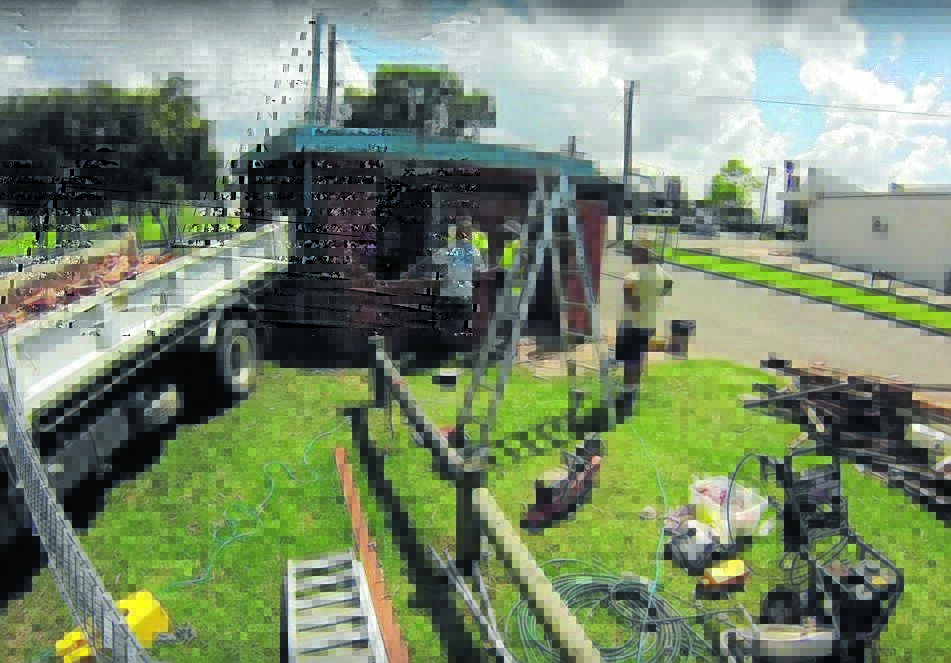 Volunteers knocked down and lifted 13 tonnes of bricks into a truck for disposal.