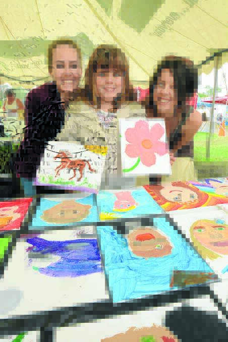 Getting arty: Jenna Ryan, Emma Padwick and Sarah Jane inside the art tent at Camp Memories.