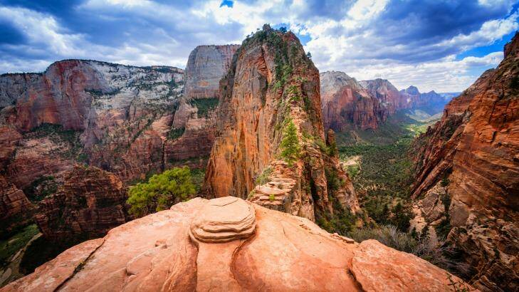 The final precarious section of the hiking trail to Angels Landing in Zion National Park, Utah. Angels Landing is at the top of the red sandstone cliffs in the centre of the picture and provides views of the whole of Zion Canyon. Photo: iStock
